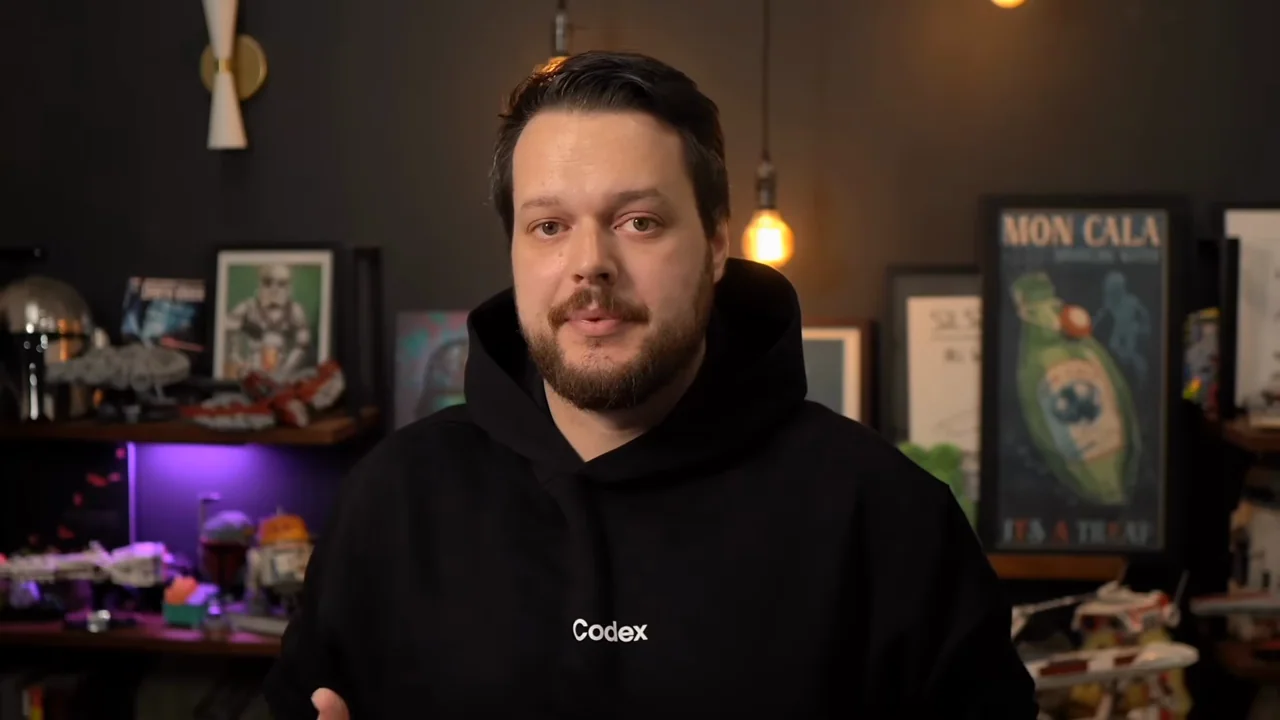 A presenter introduces the workflow from a fixed room view.