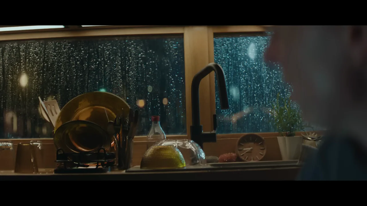 Faces, a desk, and a kitchen window recur as ordinary objects become focal points.