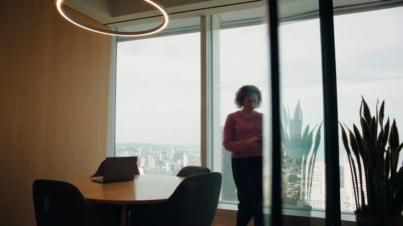Window and office shots establish a working setting.