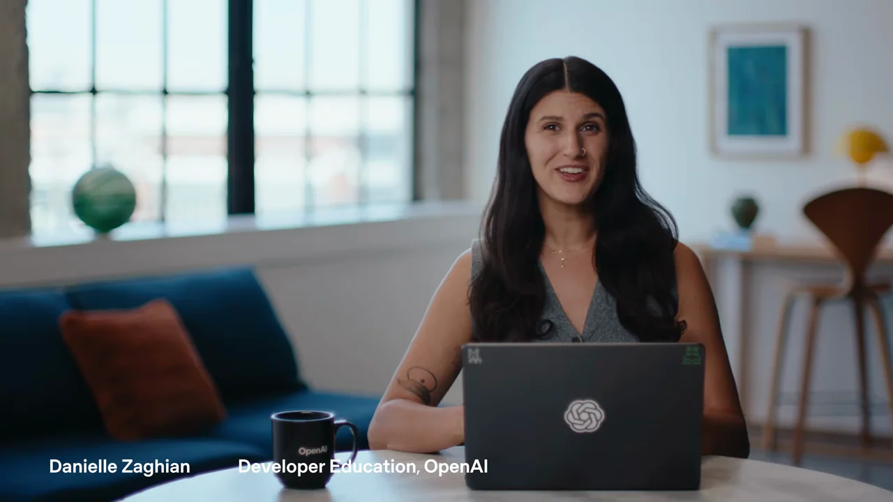 The presenter explains the use case at the desk.